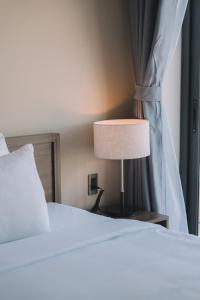 Letto o letti in una camera di Canary Dalat Hotel