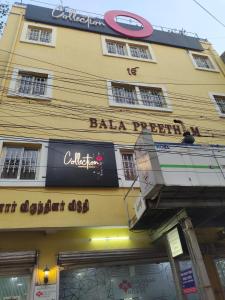 a building with a sign on the front of it at Gulnaar Inn in Chennai