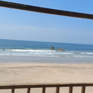 a view of the beach from a fence at Nana's Nook in Agonda