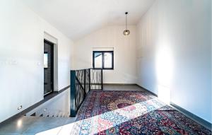 an empty hallway with a rug on the floor at Beach Front Home In Pridraga in Pridraga