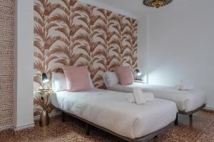 Postel nebo postele na pokoji v ubytování tuGuest Gran Via 42