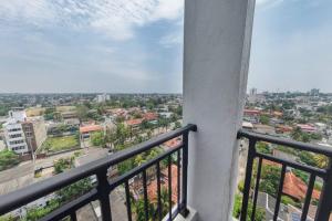 a balcony with a view of a city at Rush Reliance Mt. Lavinia in Attidiya
