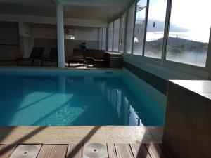 Bazén v ubytovaní Studio avec Piscine résidence Natureva by 8H alebo v jeho blízkosti