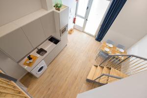 an overhead view of a kitchen and a living room at FLORIT FLATS - The Seagull Apartments in Valencia