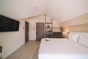 Letto o letti in una camera di Canary Dalat Hotel