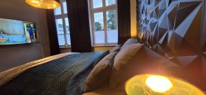 a bedroom with a bed with a light on it at Mastersuite in Bad Salzuflen