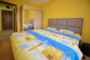 Postel nebo postele na pokoji v ubytování Apartman Odzaci