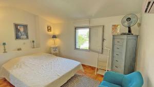 En eller flere senge i et værelse på Les Hauts du Sémaphore