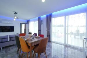 a dining room with a table and chairs at Villa Mila Fethiye in Fethiye