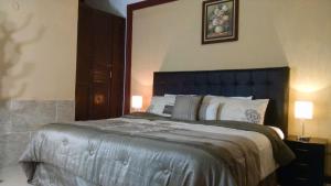 Säng eller sängar i ett rum på Hotel Maya Ah Kim Pech