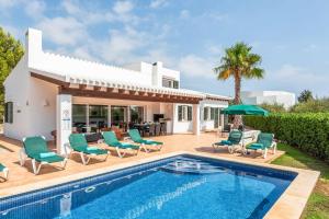 an image of a villa with a swimming pool at Bini Rosa in Binibeca