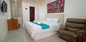 Letto o letti in una camera di RNR Suites