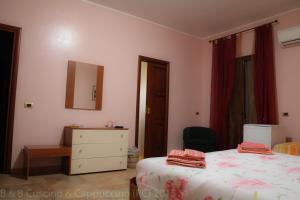 A bed or beds in a room at Cuscino & Cappuccino