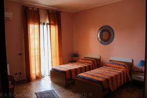 A bed or beds in a room at Cuscino & Cappuccino