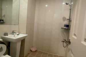 a bathroom with a shower and a sink at Namhangang Park Motel in Chungju