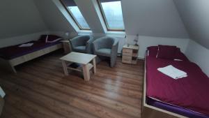 Tempat tidur dalam kamar di Tisza Panzió és Apartman