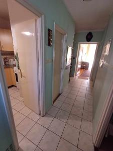 a hallway of a house with a hallway at Tavas Barlang Apartman Tapolca in Tapolca