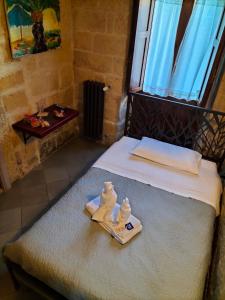 Postel nebo postele na pokoji v ubytování B&B Malennio