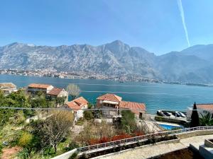 a view of a body of water with mountains at Blanka Sea View Apartments in Kotor