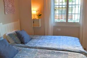 A bed or beds in a room at Apartamento en primera linea de playa