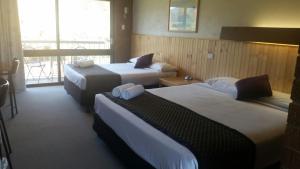 Postel nebo postele na pokoji v ubytování Motel Sierra - Bright