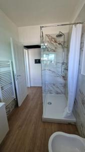 a bathroom with a shower and a toilet in it at Cozy flat in Rome in Rome