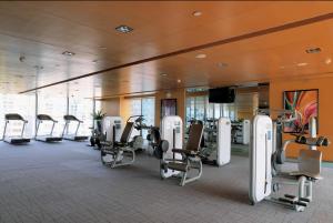 a gym with cardio equipment in a hotel room at Four Points by Sheraton Guangzhou, Dongpu in Guangzhou