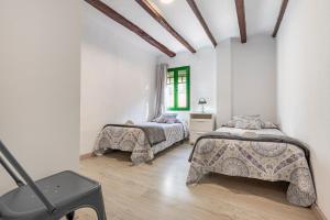 Posteľ alebo postele v izbe v ubytovaní Bettatur Apartaments Rera Sant Domenech