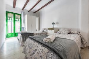 Posteľ alebo postele v izbe v ubytovaní Bettatur Apartaments Rera Sant Domenech