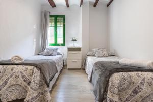 Posteľ alebo postele v izbe v ubytovaní Bettatur Apartaments Rera Sant Domenech