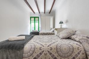 Posteľ alebo postele v izbe v ubytovaní Bettatur Apartaments Rera Sant Domenech