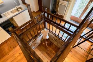 an overhead view of a room with wood floors and a table at Atypical apartment in the heart of Old Lille! in Lille