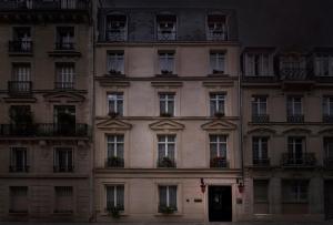 a facade of a building with windows and a door at Maison Souquet, Hotel & Spa in Paris