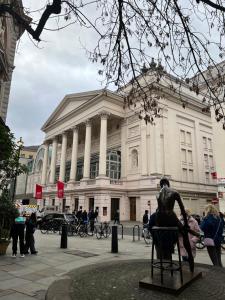 a large building with a statue in front of it at Quiet Luxury Escape for 6 in Covent Garden in London