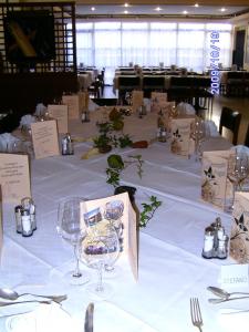 a table with wine glasses on top of it at Hotel Ceresio in Lugano