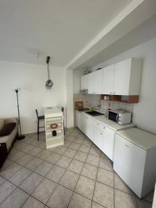 Kuchyň nebo kuchyňský kout v ubytování Apartments and Rooms Markovski