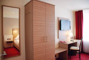 Postel nebo postele na pokoji v ubytování Hotel Mühleneck