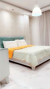 Postel nebo postele na pokoji v ubytování Warm apartment