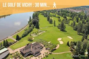 an aerial view of a house with a golf estate at Studio cosy avec mezzanine calme hypercentre Villa Marie Celine in Vichy