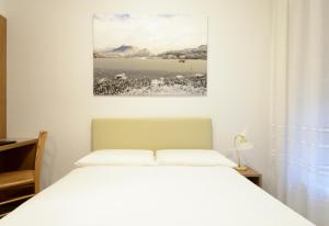 Letto o letti in una camera di Hotel Ceresio