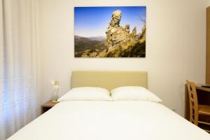Letto o letti in una camera di Hotel Ceresio