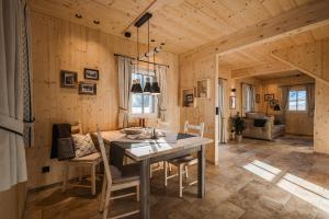 a kitchen and dining room with a table and chairs at Chalet Jochwand Bad Goisern - Your Austrian Home in Bad Goisern