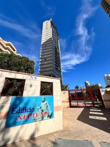 a sign in front of a tall building at Neptuno View 22 in Benidorm