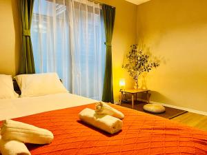 Postel nebo postele na pokoji v ubytování JoyHome 天下茶屋駅7分4LDK一軒家 難波梅田黒門関空直通 無料駐車場
