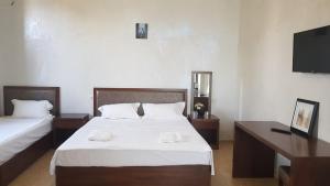 Letto o letti in una camera di IVERIA BEACH