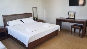 Letto o letti in una camera di IVERIA BEACH