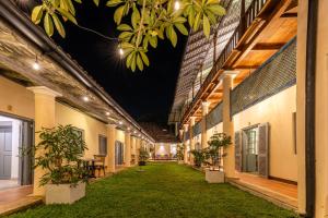 an empty corridor of a building at night at The Dutch Bungalow in Galle