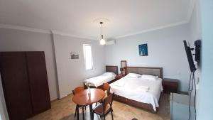 Letto o letti in una camera di IVERIA BEACH
