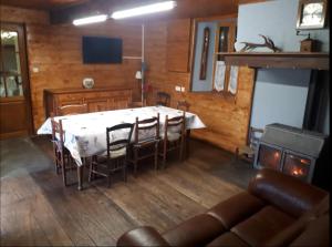 a dining room table and chairs in a room at Chez Sagaret in Chein-Dessus