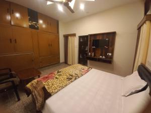 Postel nebo postele na pokoji v ubytování Kalash Guest House